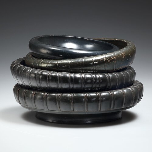 Four Small Black-glazed Bowls
