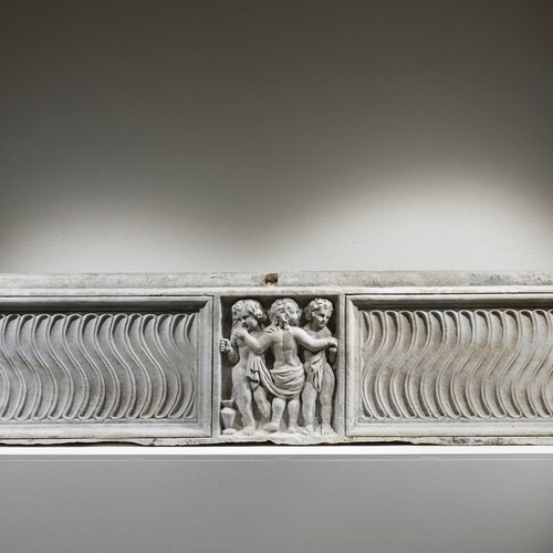 A Strigilated Sarcophagus with The Three Graces