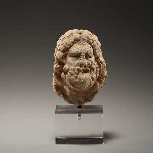 A Small Head of a Bearded God, possibly Serapis